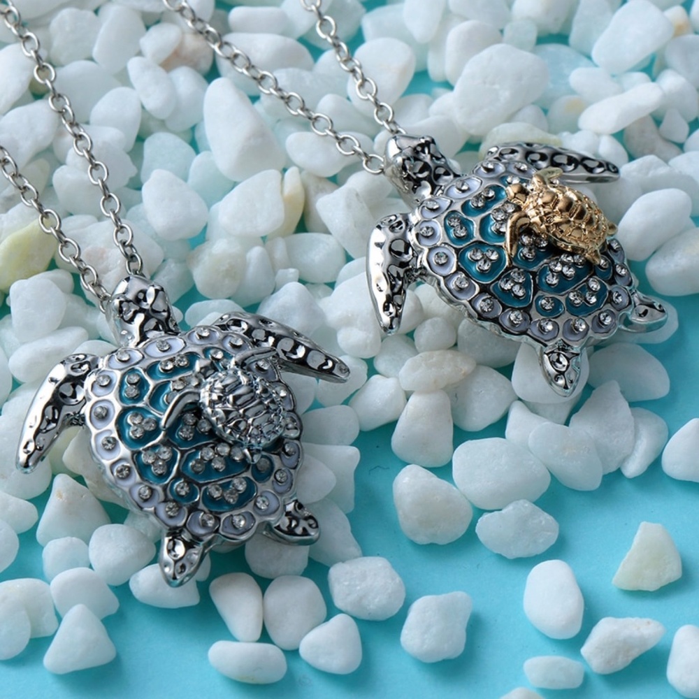 Beautiful silver sea turtles with gold necklace